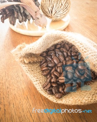 Coffee Roasted Bean On Wooden Table Vintage Style Stock Photo