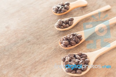 Coffee Spoons On Grunge Wooden Table Stock Photo