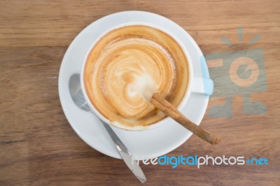 Coffee With Latte Art On Wooden Table Stock Photo