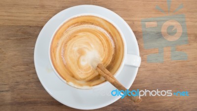 Coffee With Latte Art On Wooden Table Stock Photo