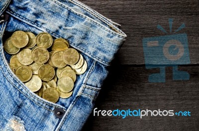 Coin Stack And Blue Jeans Lack Stock Photo