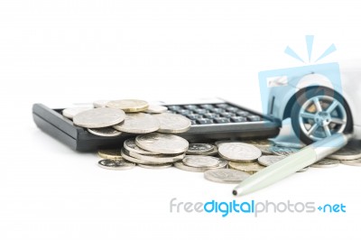 Coins, Calculator, Pen And Car Stock Photo