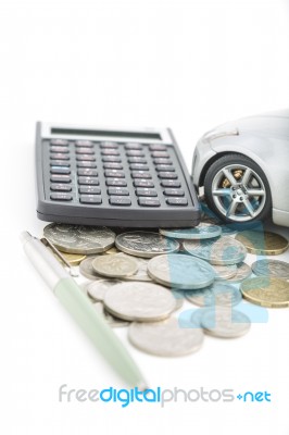 Coins, Calculator, Pen And Car Stock Photo