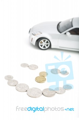 Coins On White With Car Stock Photo