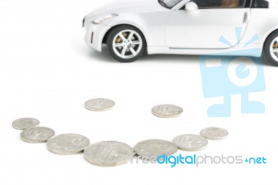 Coins On White With Car Stock Photo