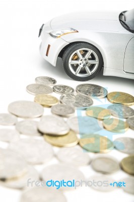 Coins On White With Car Stock Photo