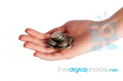 Coins Piled Up In Womans Hand Stock Photo