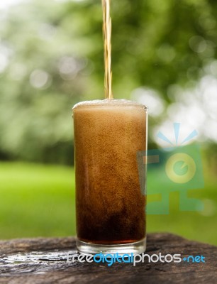 Cola Pouring In A Glass Stock Photo