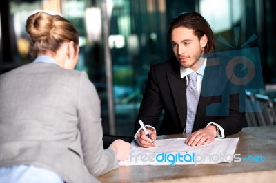 Colleagues Discussing Business Plan Stock Photo