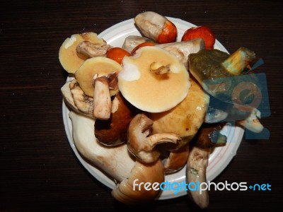 Collection And Preparation Of Autumn Edible Mushrooms Stock Photo