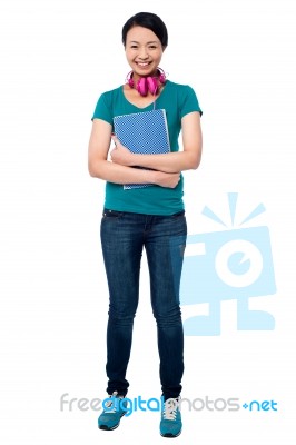 College Girl With Headphones Around Her Neck Stock Photo