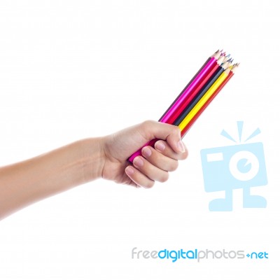 Colored Pencils In A Female Hand On A White Background  Stock Photo