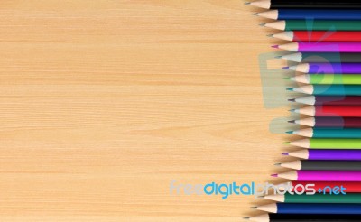 Colored Pencils On Wooden Board Stock Image