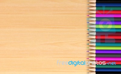 Colored Pencils On Wooden Board Stock Image