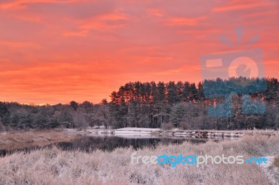 Colorful Autumn Dawn. Red Sky And Clouds. First Snow In The Autu… Stock Photo