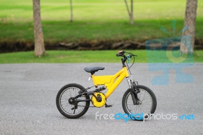 Colorful Bicycle Parked On The Street In The Park Stock Photo