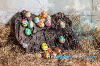 Colorful Easter Egg On Old Log Stock Photo