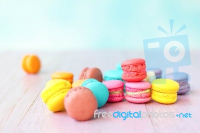 Colorful Macarons On A Pink Wooden Table Stock Photo