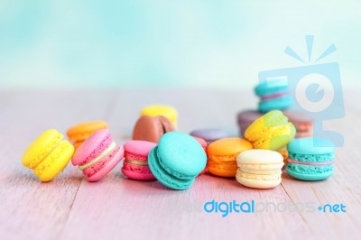 Colorful Macarons On A Pink Wooden Table Stock Photo