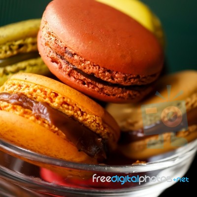 Colorful Macaroons In The Little Glass Blow Stock Photo