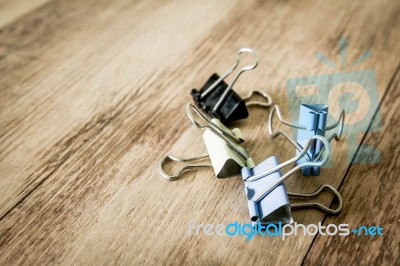 Colorful Paper Clip On Wood Table Stock Photo