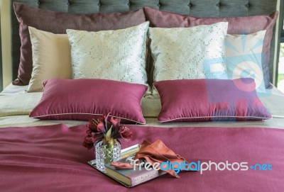 Colorful Pillow And Decorative Tray With Book, Flower On The Bed… Stock Photo