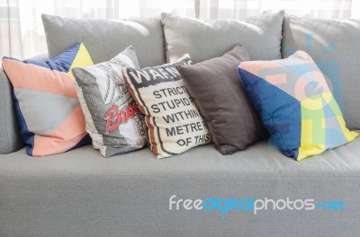 Colorful Pillows On Modern Grey Sofa In Living Room Stock Photo