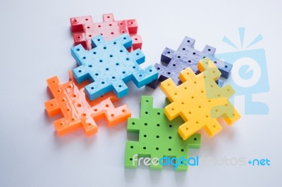 Colorful Plastic Jigsaw Puzzle Game Stock Photo