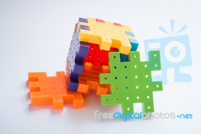 Colorful Plastic Jigsaw Puzzle Game Stock Photo