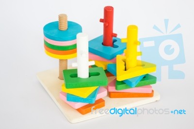 Colorful Puzzle Wooden Toy On White Table Stock Photo