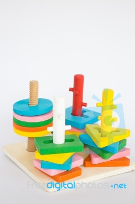 Colorful Puzzle Wooden Toy On White Table Stock Photo