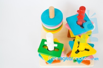 Colorful Puzzle Wooden Toy On White Table Stock Photo