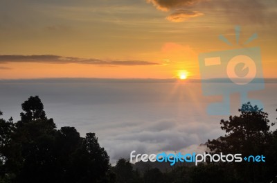 Colorful Sunrise Above The Clouds Stock Photo