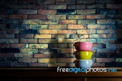 Colorful Tiffin Carrier On Wooden Cupboard Stock Photo