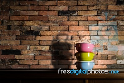 Colorful Tiffin Carrier On Wooden Cupboard Stock Photo