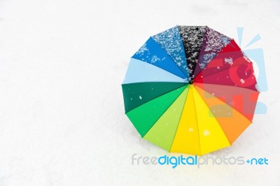 Colorful Umbrella In The Fresh Snow Stock Photo