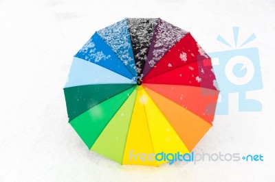 Colorful Umbrella In The Fresh Snow Stock Photo