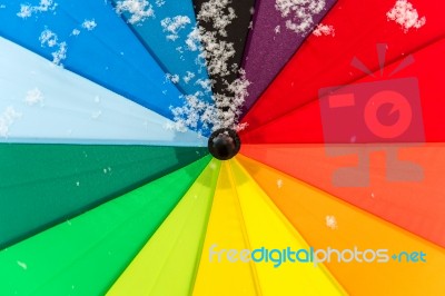 Colorful Umbrella In The Fresh Snow Stock Photo