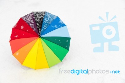 Colorful Umbrella In The Fresh Snow Stock Photo