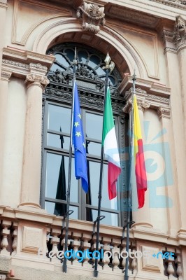 Colourful Flags On A Building In Bergamo Stock Photo