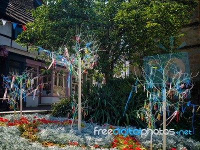 Colourful Looms And Ribbons On Artificial Trees In East Grinstea… Stock Photo