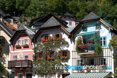 Colourful Red Geraniums On Houses In Hallstatt Stock Photo