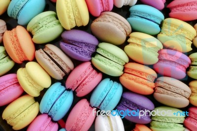 Colourful Tasty Sweet Macaroons Dessert On Black Background Stock Photo