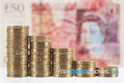 Columns Of British Pound Sterling Coins In Decreasing Heights Stock Photo