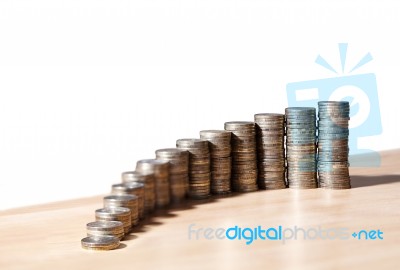 Columns Of Coins On The Table Stock Photo