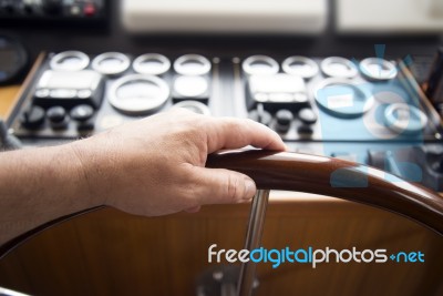 Commander Hands On The Boat Wheel Stock Photo