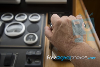 Commander Hands On The Boat Wheel Stock Photo