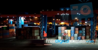 Commercial Container Port At Night Stock Photo