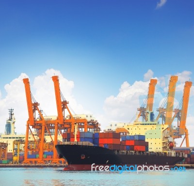 Commercial Ship And Cargo Container On Port Use For Import Expor… Stock Photo