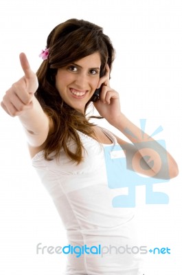 Communicating Female Showing Thumbs Up Stock Photo